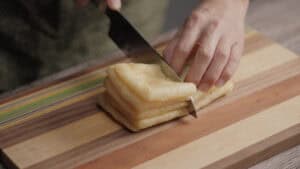 Cutting fried tofu