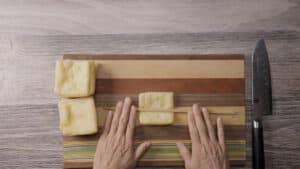 Roll the fried tofu with chopsticks