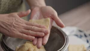 Squeezing fried tofu