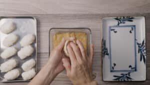 Filling tofu packet with rice ball