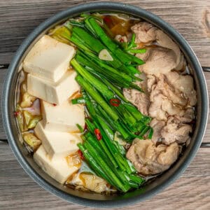 Pork, Tofu, and Garlic Chives soup in a pot