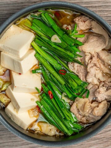 Pork, Tofu, and Garlic Chives soup in a pot